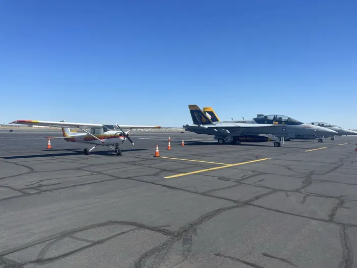 Cessna 150 N10951 next to two F/A-18 Hornets on the ramp at KMWH (Moses Lake, WA)