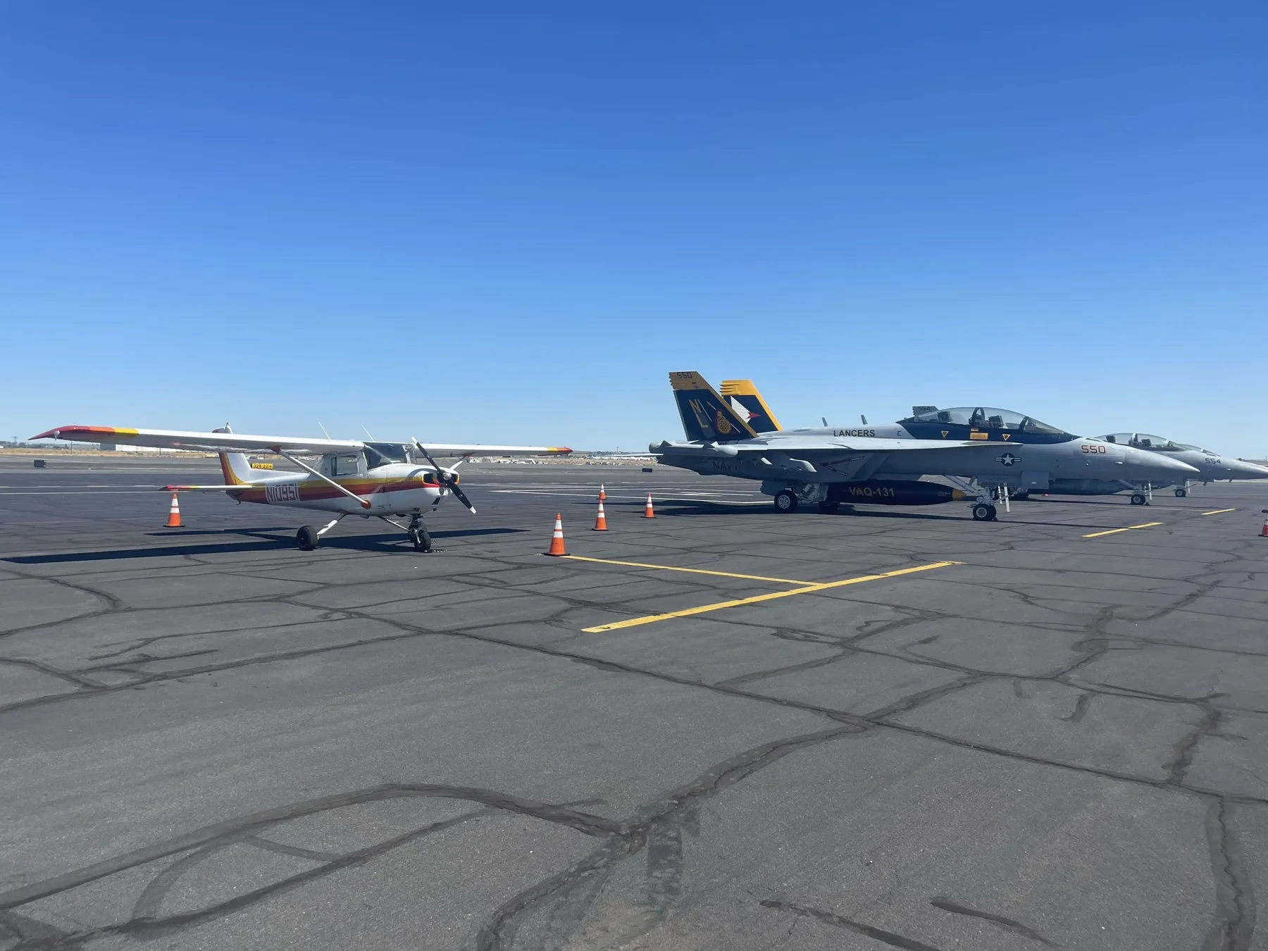 Cessna 150 N10951 next to two F/A-18 Hornets on the ramp at KMWH (Moses Lake, WA)
